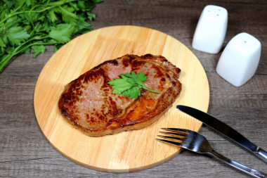 Marbled beef steak in a frying pan